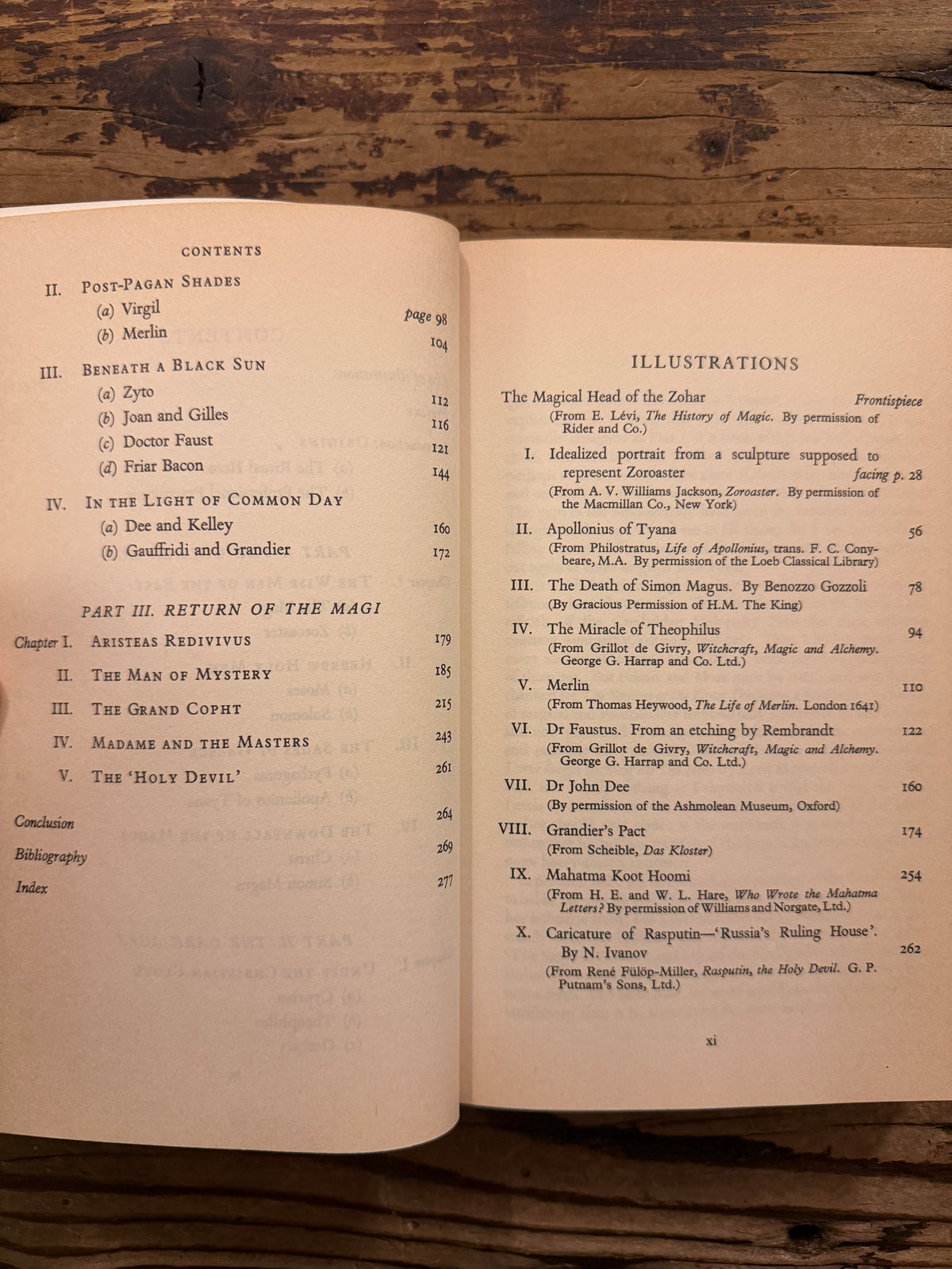 Open book with the title 'The Myth of the Magnus' by E.M. Butler lying on a wooden surface