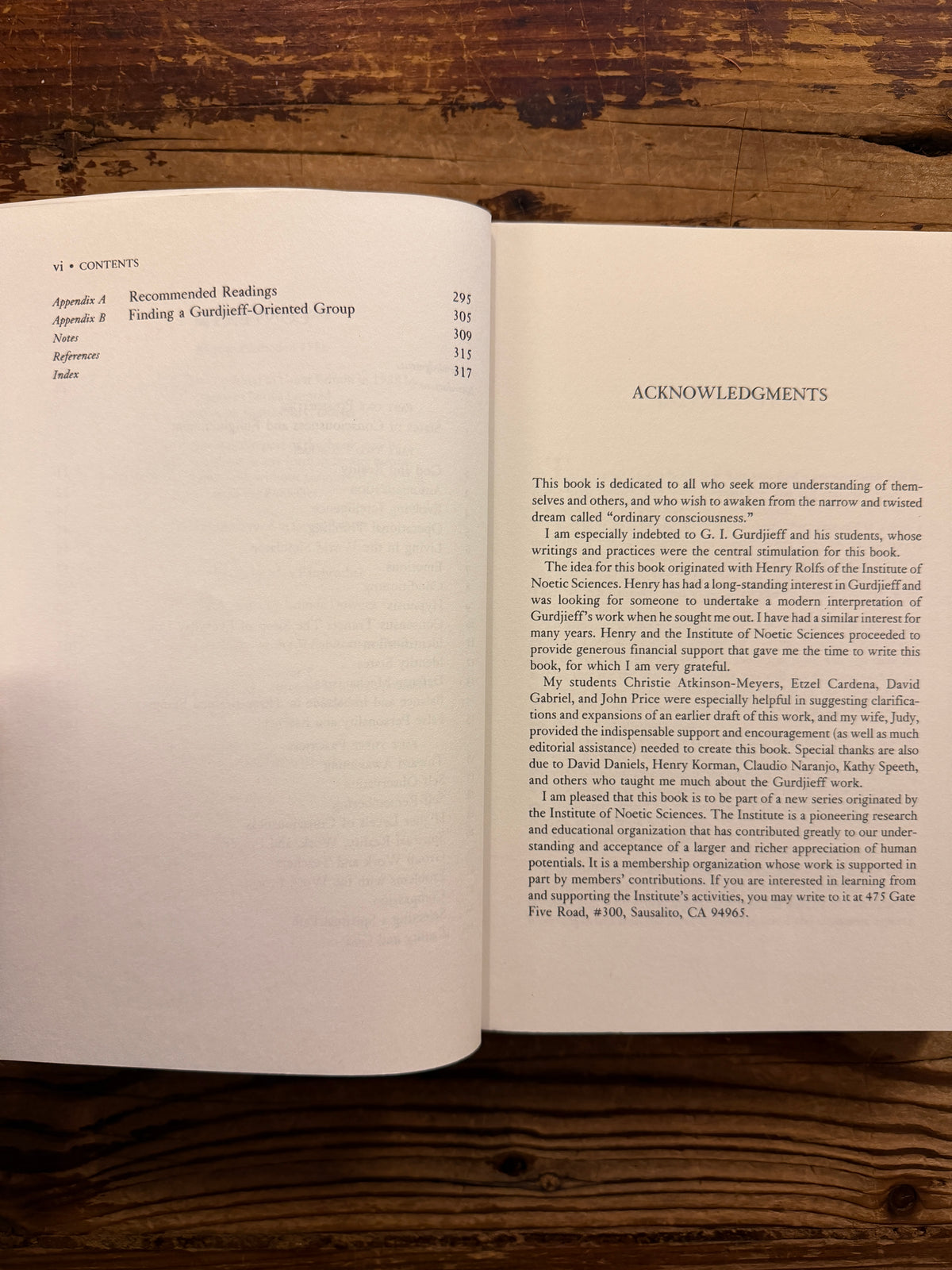 Open book with the title 'Waking up' by Charles T. Tart