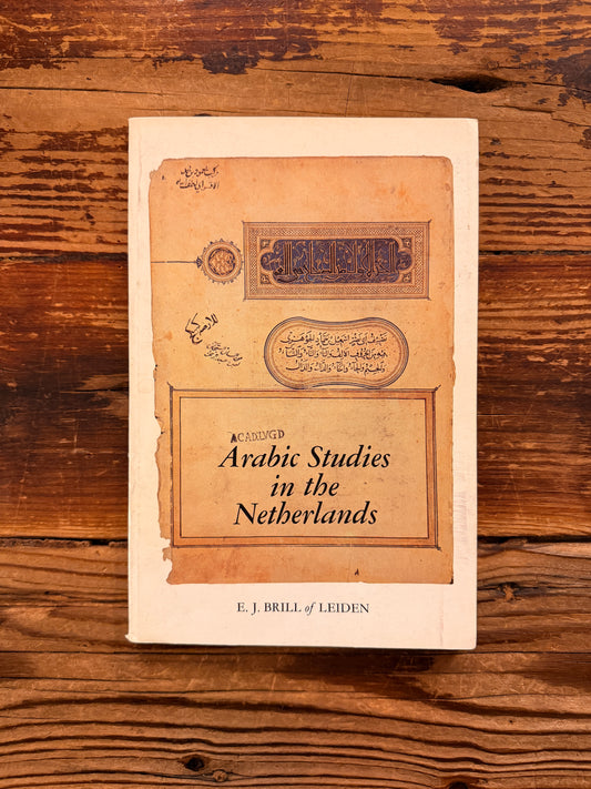 Front cover of a book titled 'Arabic Studies in the Netherlands' by J. Brugman en F. Schröder, lying on a wooden surface