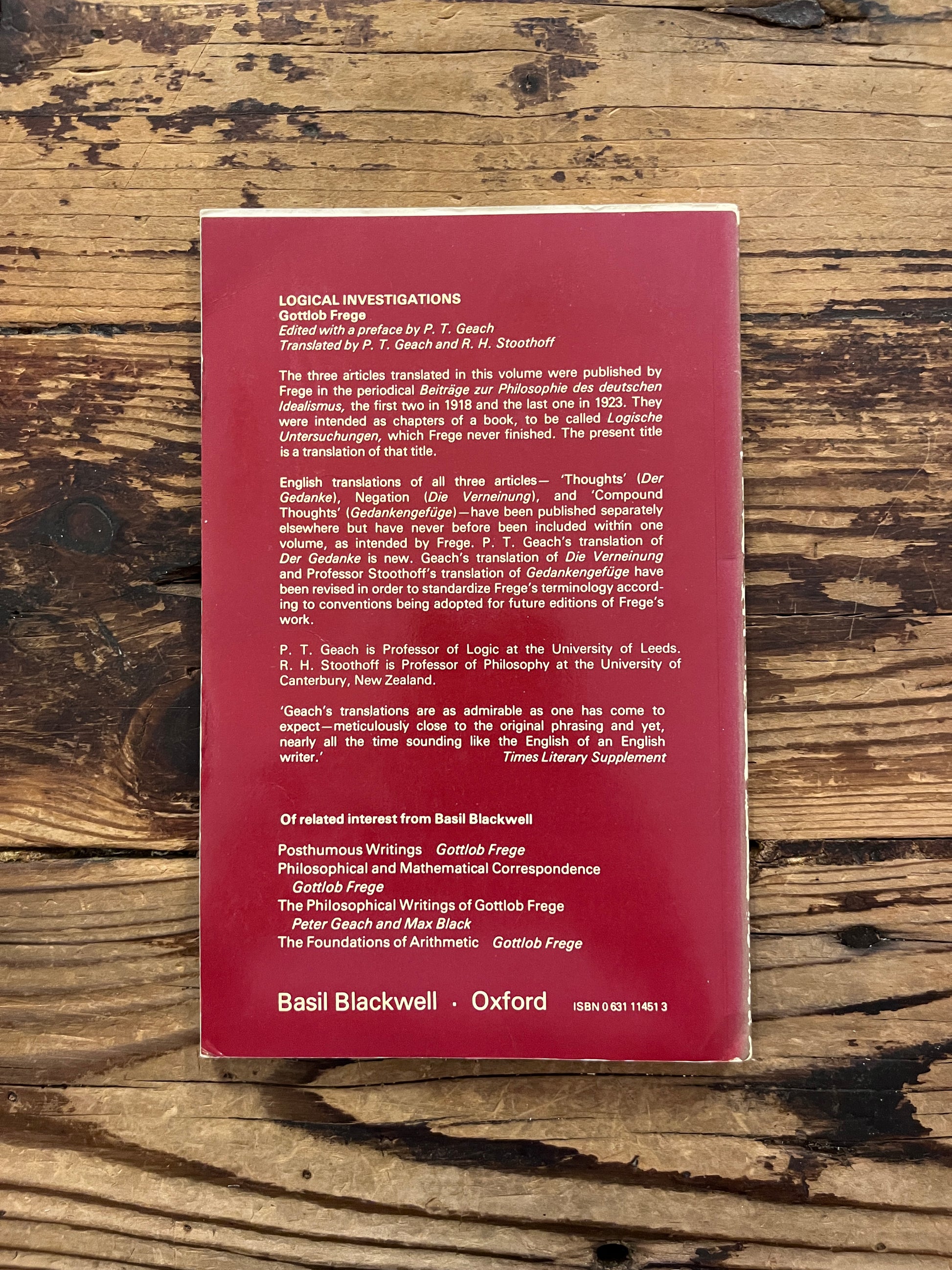 photo of the cover of the book logical investigations" on a wooden background