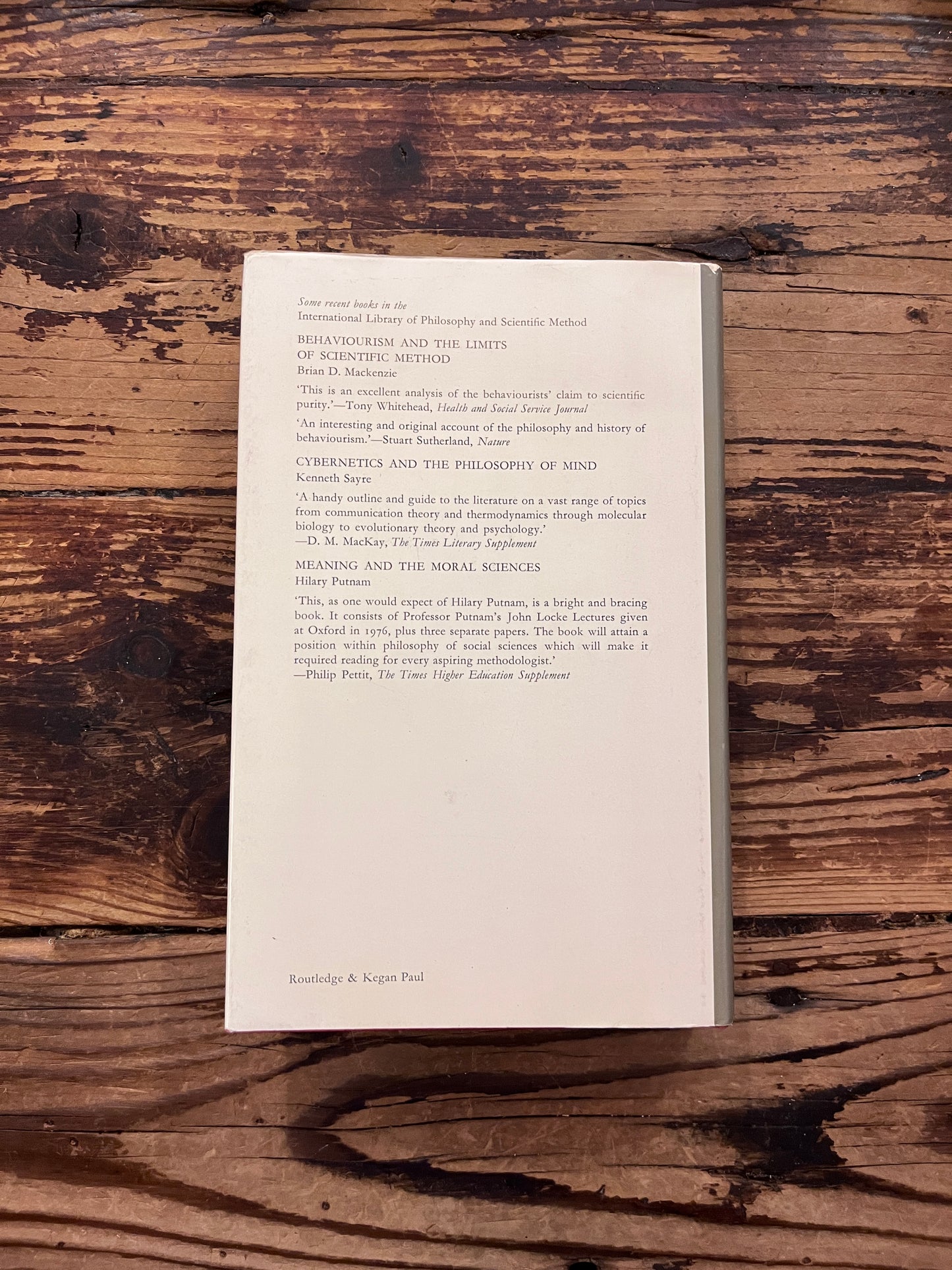photo of the cover of the book "Political Argument" on a wooden background