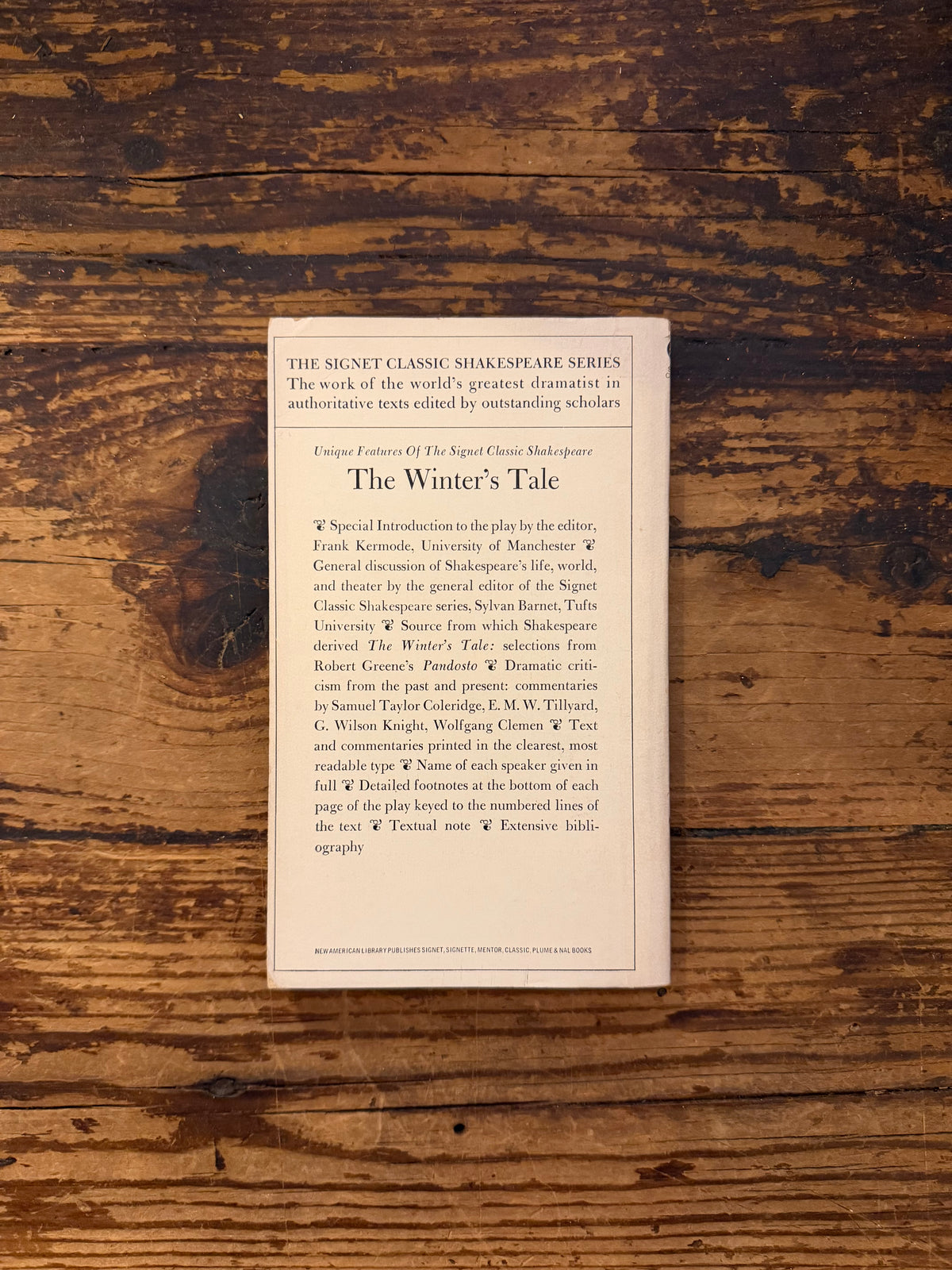 photo of the cover of the book "the winter's tale" on a wooden background